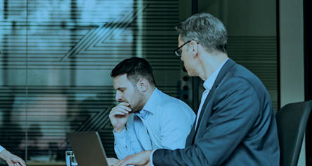 Young couple and their lawyers talking about the divorce during a meeting in the office. Copy space.